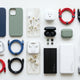 mobile accessories including phone cases, charging cables, earbuds, power banks arranged neatly 