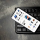 A smartphone displaying an online shopping interface for electronics and clothing.